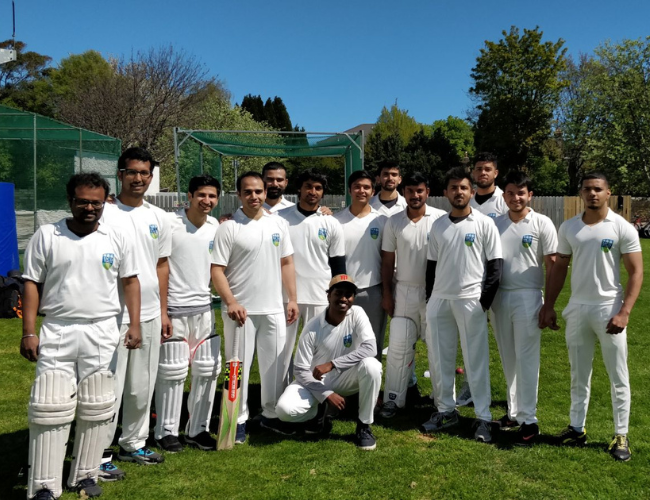 Cricket club members standing for a photo